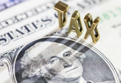 Banconota statunitense con la scritta Tax.