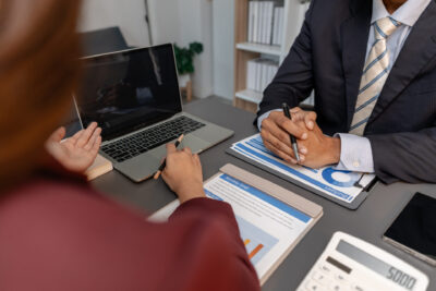 Business professionals meeting to discuss and review HMRC check
