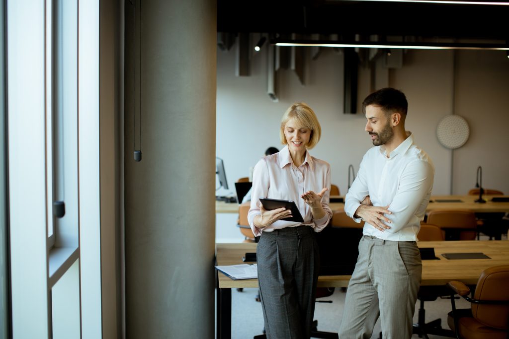two-professionals-discussing-work