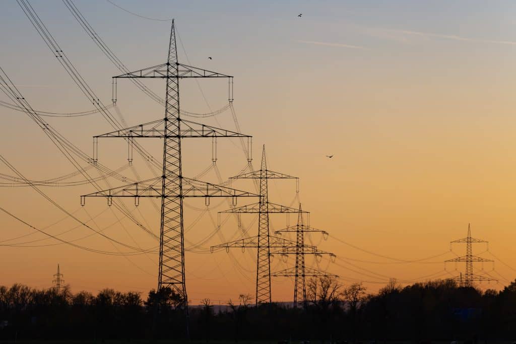 power-lines-at-sunset-over-a-rural-landscape