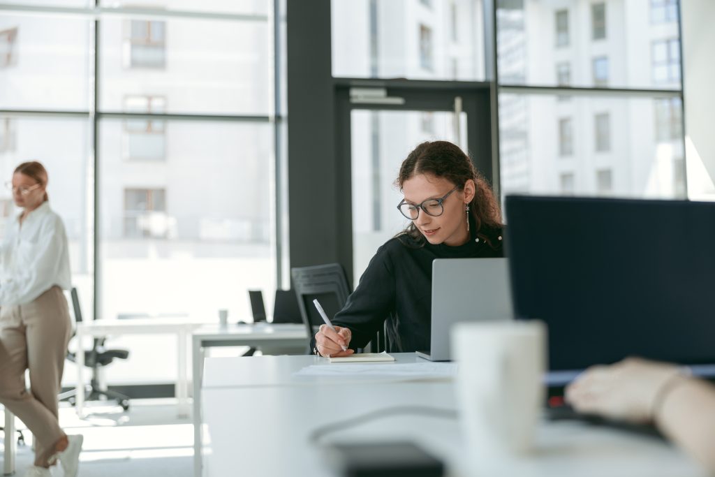 stylish-businesswoman-making-notes
