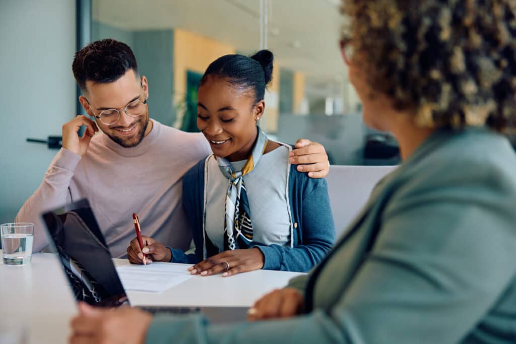 young-happy-couple-singing-a-contract-with-bank