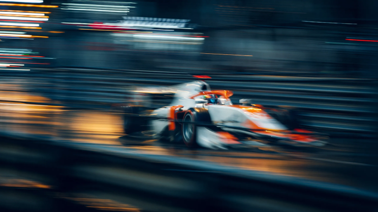 F1 car driving at high speed around the track