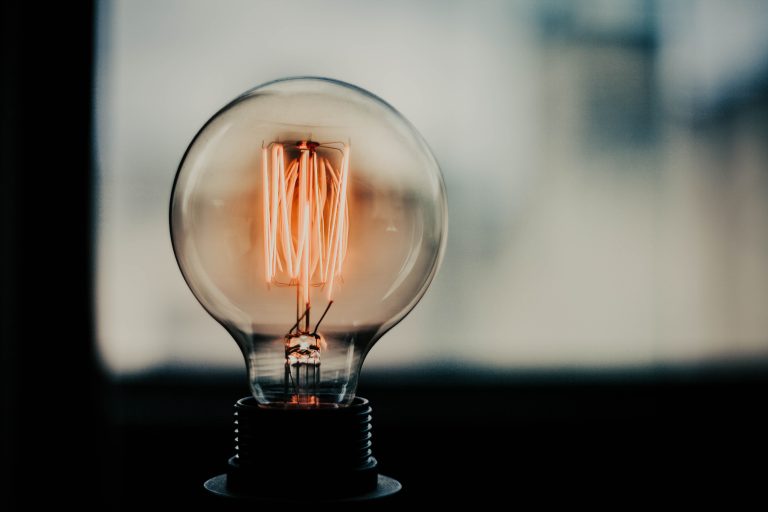 Lit vintage lightbulb representing innovation and patented inventions